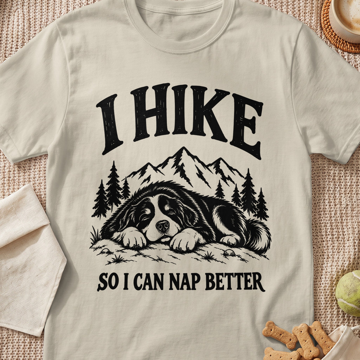 T-shirt with "I HIKE SO I CAN NAP BETTER" text and a sleeping dog illustration.