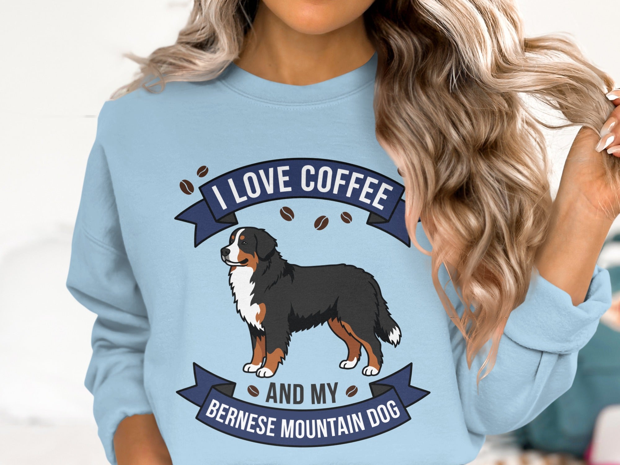 Light blue sweatshirt with Bernese Mountain Dog, coffee beans, and text "I LOVE COFFEE AND MY BERNESE MOUNTAIN DOG".