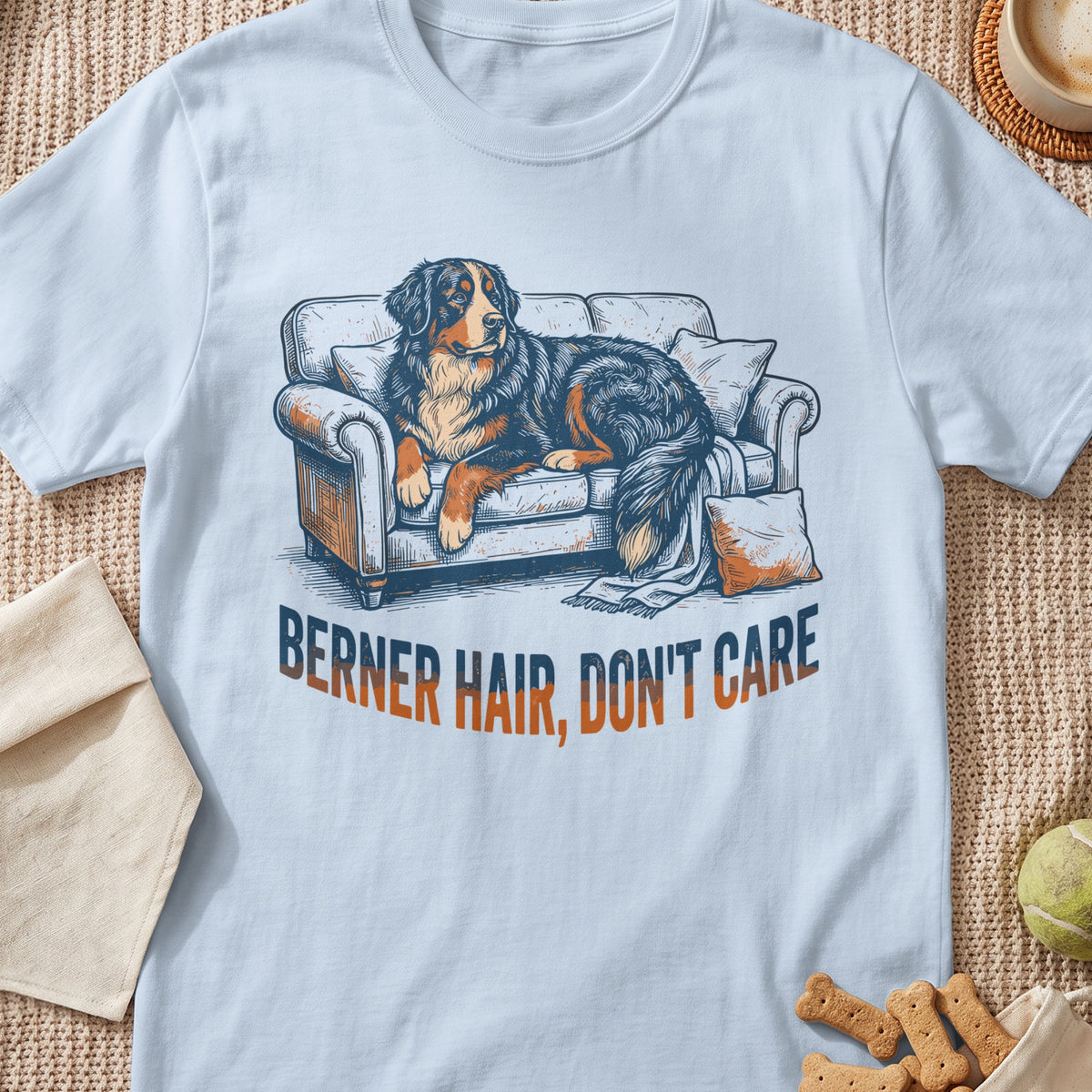 Bernese Mountain Dog lounging on a couch with text "BERNER HAIR, DON'T CARE".