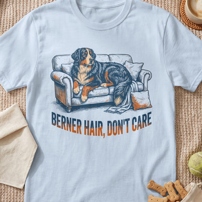 Bernese Mountain Dog lounging on a couch with text "BERNER HAIR, DON'T CARE".