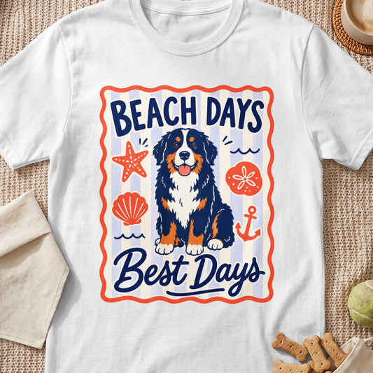 A white t-shirt featuring a Bernese Mountain Dog graphic surrounded by beach-themed icons and the text BEACH DAYS Best Days.