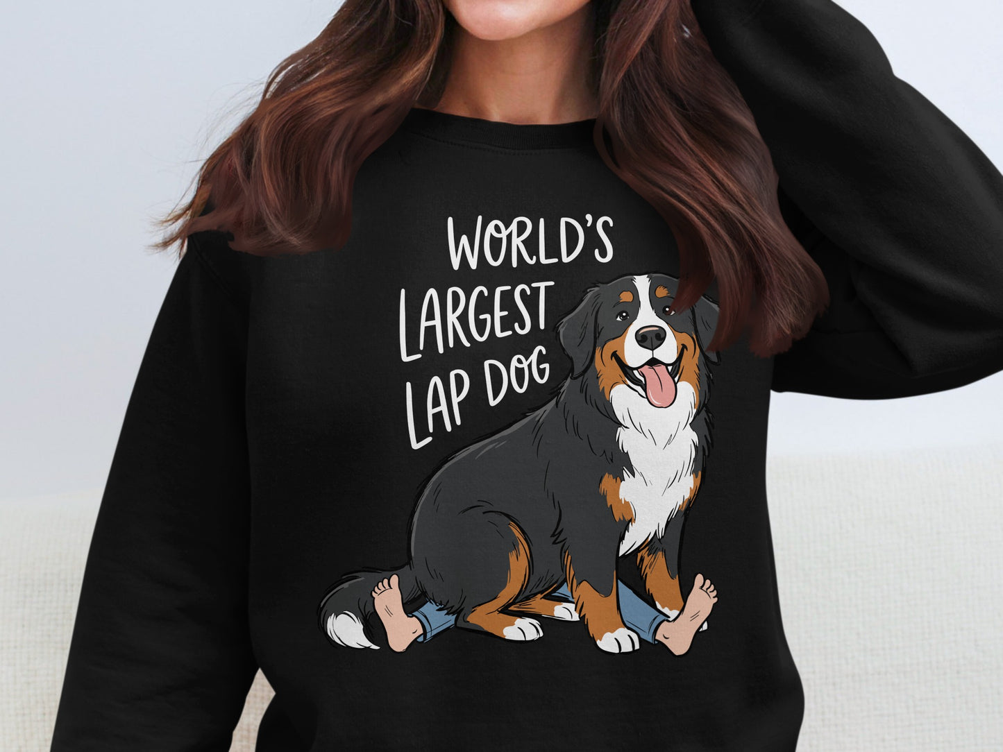 Bernese Mountain Dog cartoon on black sweatshirt with "World's Largest Lap Dog" text.