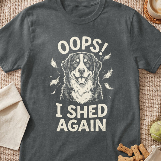 Dark grey t-shirt with a drawing of a happy dog and text that reads "OOPS! I SHED AGAIN".