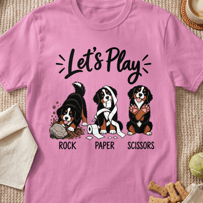 Three Bernese Mountain Dogs play rock, paper, scissors with text.