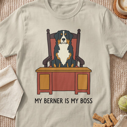 Bernese Mountain Dog sitting in a chair behind a desk with text "MY BERNER IS MY BOSS".