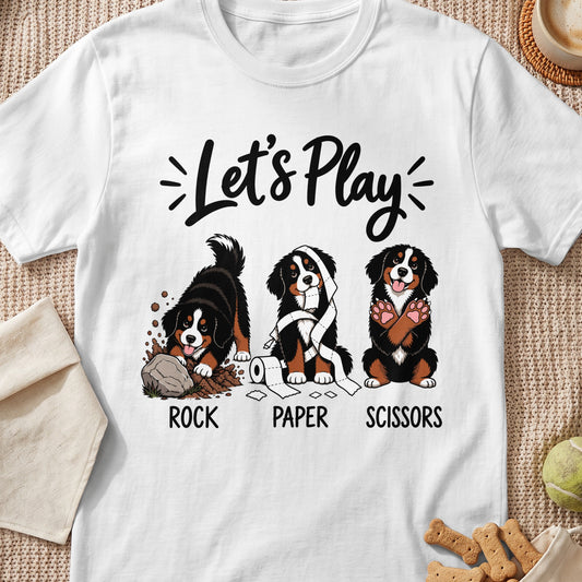 Bernese Mountain Dogs playing Rock Paper Scissors on a white t-shirt.