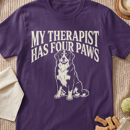 Purple t-shirt with white text "MY THERAPIST HAS FOUR PAWS" and a dog graphic.