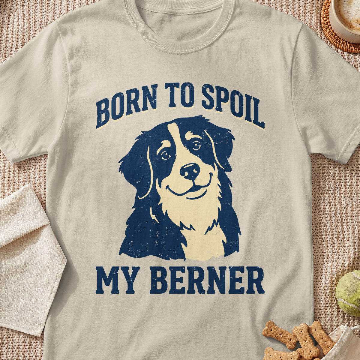 Light beige t-shirt with navy graphic: "BORN TO SPOIL MY BERNER" and a dog.