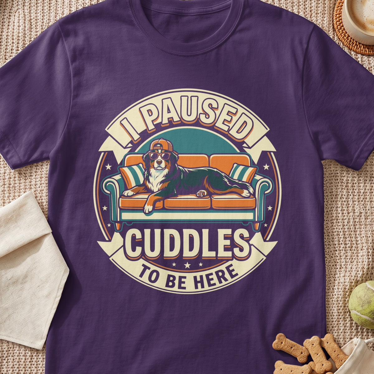 Bernese Mountain Dog on couch graphic with text "I paused cuddles to be here".