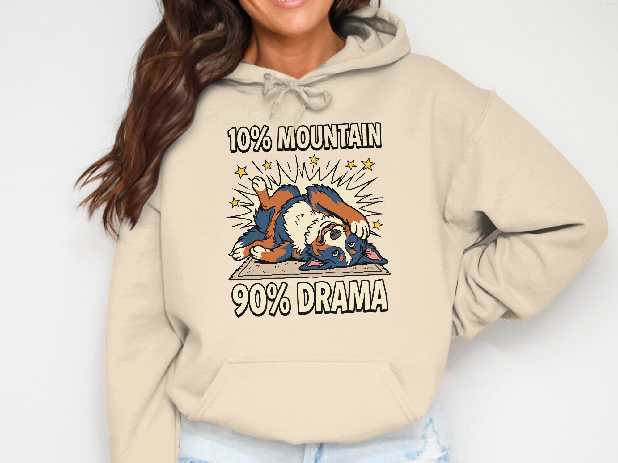 Bernese Mountain Dog with text "10% Mountain 90% Drama" on a cream hoodie.