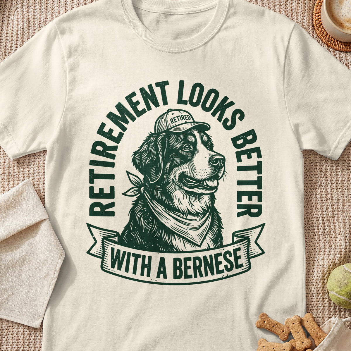 Bernese dog wearing a "Retired" hat and bandana, text "Retirement looks better with a Bernese."
