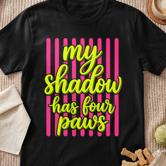 Black t-shirt with "my shadow has four paws" in yellow neon lettering.