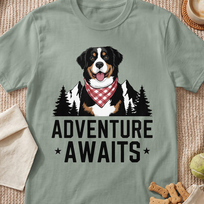Bernese Mountain Dog wearing a bandana with mountains and trees, "Adventure Awaits" text.
