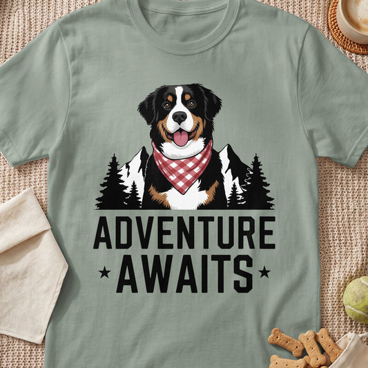 Bernese Mountain Dog wearing a bandana with mountains and trees, "Adventure Awaits" text.