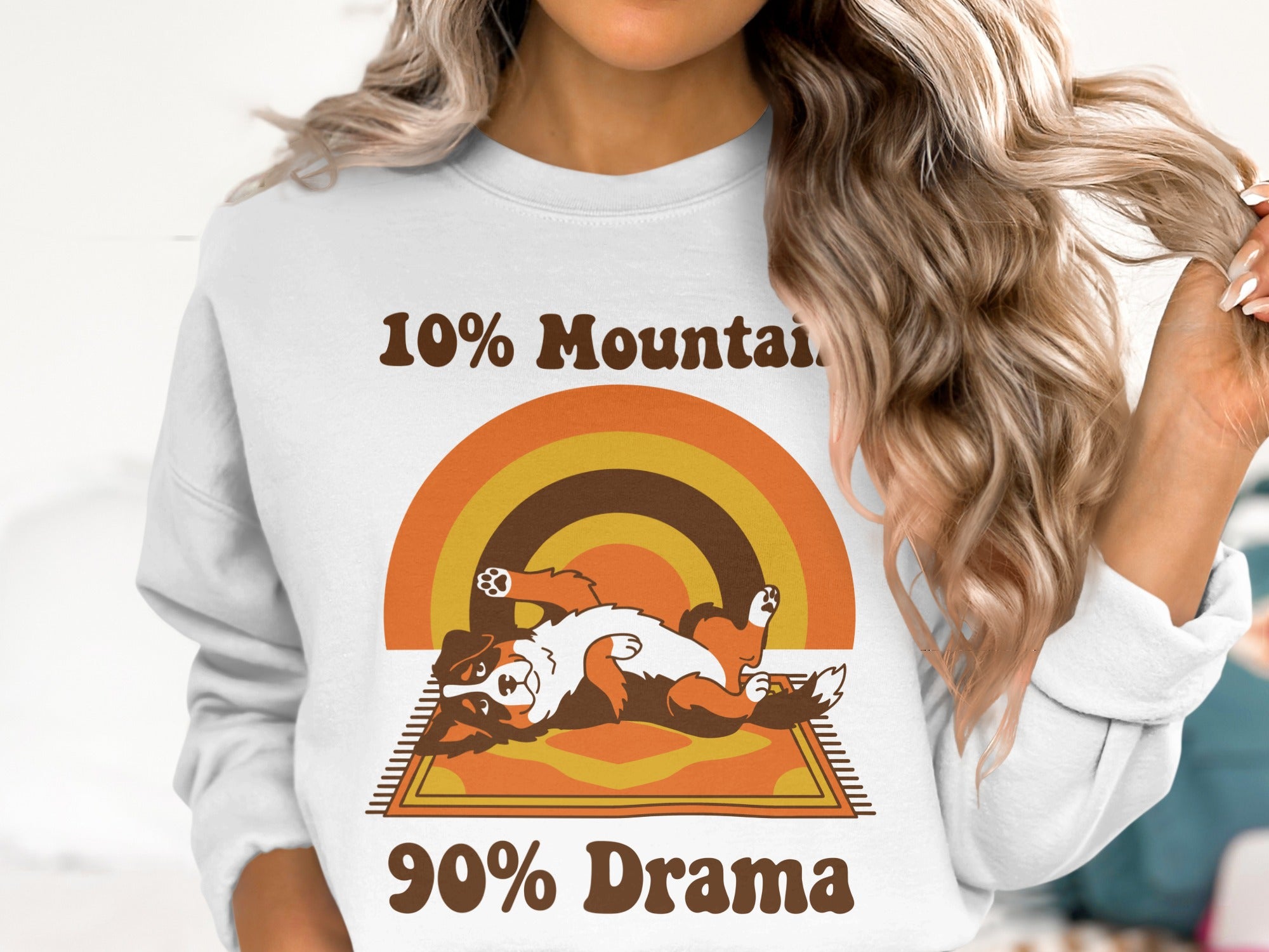 White sweatshirt with "10% Mountain 90% Drama" text and a cartoon dog.