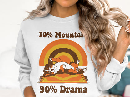 White sweatshirt with "10% Mountain 90% Drama" text and a cartoon dog.