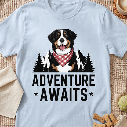 Light blue t-shirt with a Bernese Mountain Dog wearing a bandana, mountains, trees, and text.