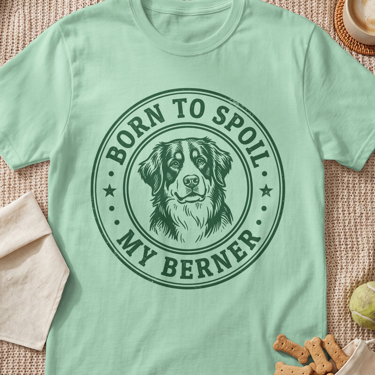 Mint green t-shirt with a green circular graphic of a Bernese Mountain Dog and text.