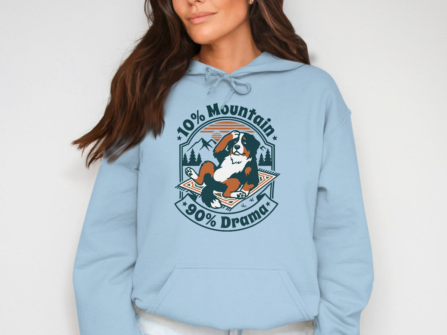 Light blue hoodie with a graphic of a Bernese Mountain Dog saying "10% Mountain, 90% Drama".