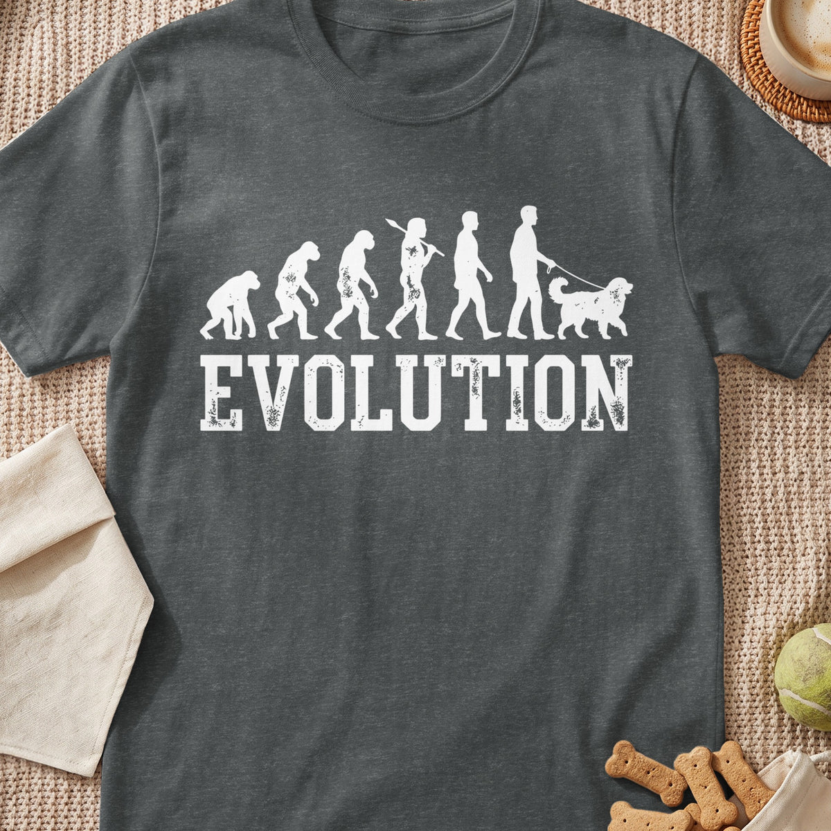 Dark t-shirt with white "EVOLUTION" text and graphic of human evolution ending with a person walking a dog.