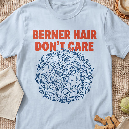 Light blue t-shirt with orange text "BERNER HAIR DON'T CARE" and a blue abstract hair ball design.