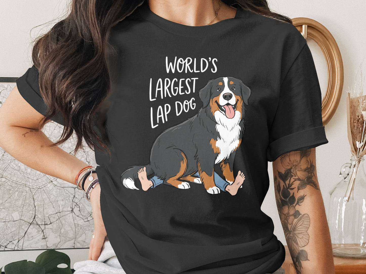 Black t-shirt featuring a Bernese Mountain Dog illustration and text "World's Largest Lap Dog".