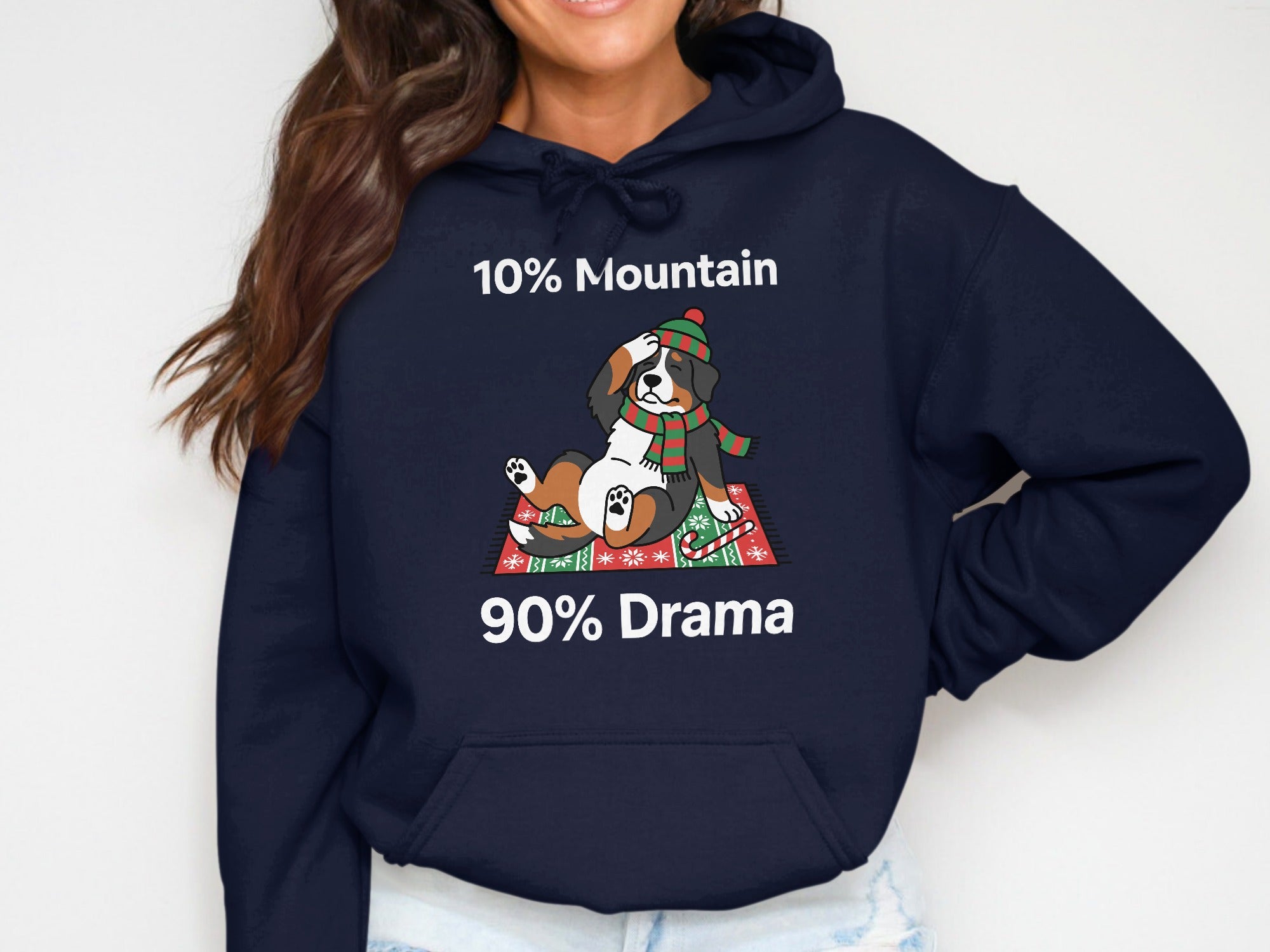 Bernese mountain dog wearing hat and scarf with "10% Mountain 90% Drama" text.