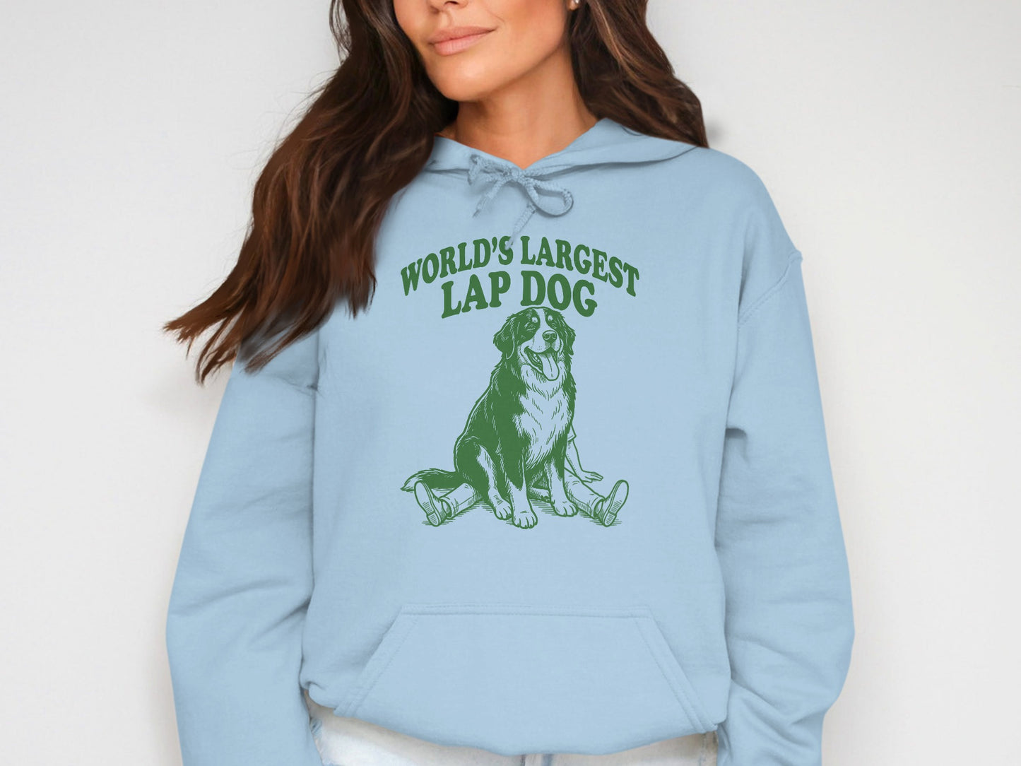 Light blue hoodie with green graphic of a dog and text "WORLD'S LARGEST LAP DOG."