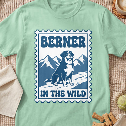 Green t-shirt with "BERNER IN THE WILD" text and a Bernese Mountain Dog in mountains.