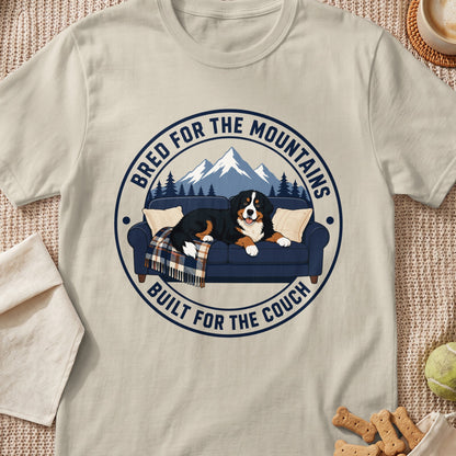 Bernese Mountain Dog on couch with text "Bred for the mountains, built for the couch."