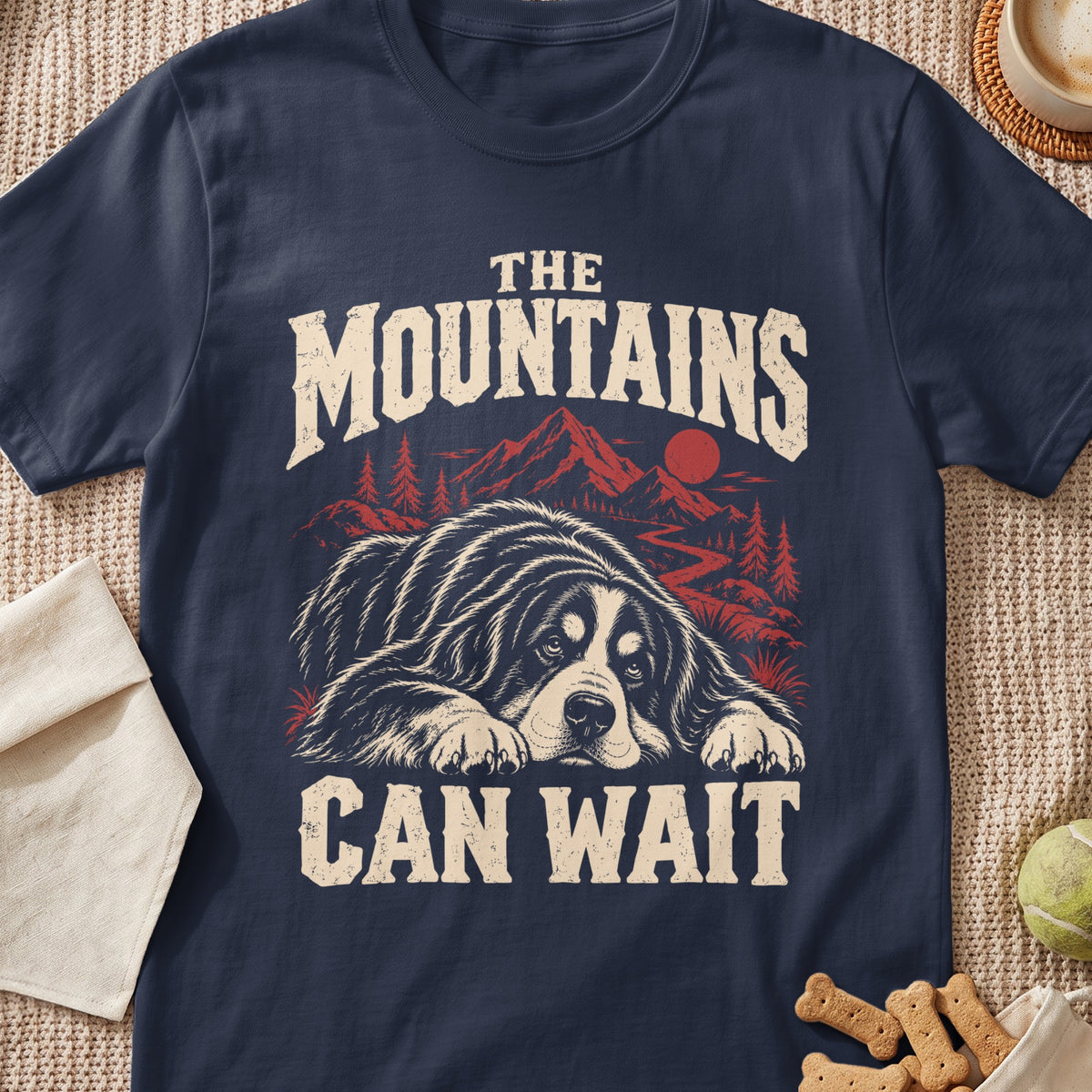 T-shirt graphic with dog, mountains, and text "The Mountains Can Wait".