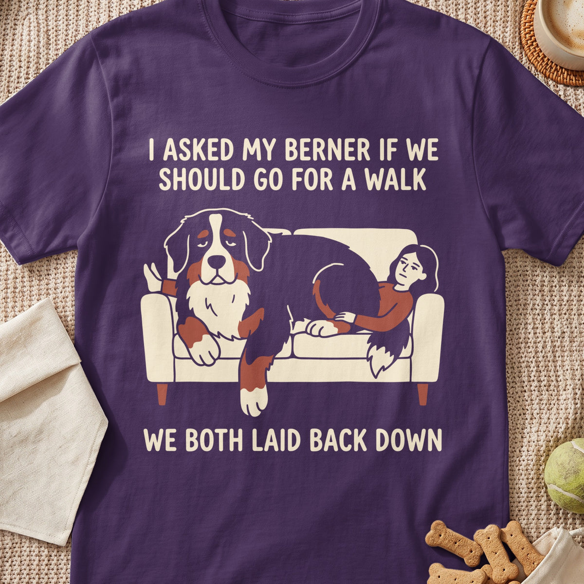 Bernese Mountain Dog and person lounging on couch with text: "I asked my Berner if we should go for a walk. We both laid back down."