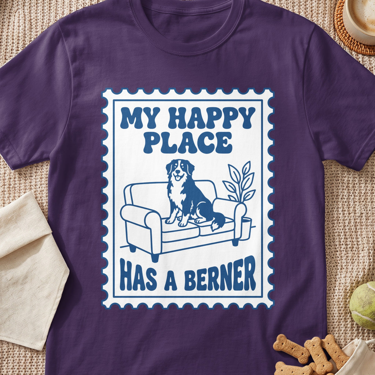 Bernese Mountain Dog on couch graphic with text "My Happy Place Has a Berner".