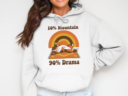 White hoodie with dog graphic and text "10% Mountain 90% Drama".