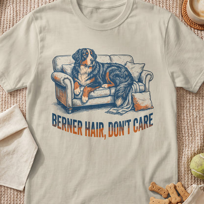 Bernese Mountain Dog resting on a couch with text "BERNER HAIR, DON'T CARE".