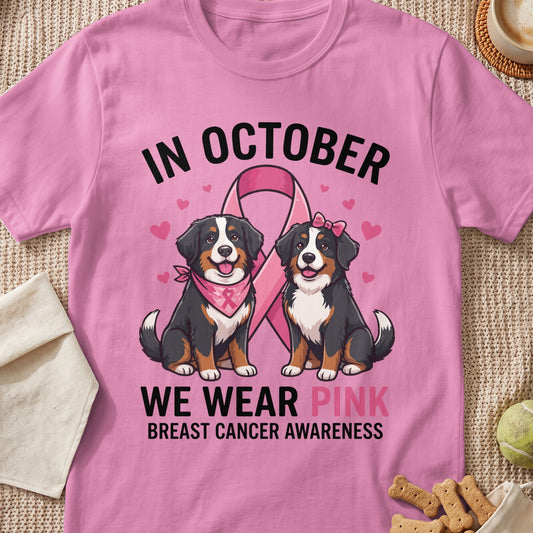 Bernese Mountain Dogs in pink bandana and bow supporting breast cancer awareness.