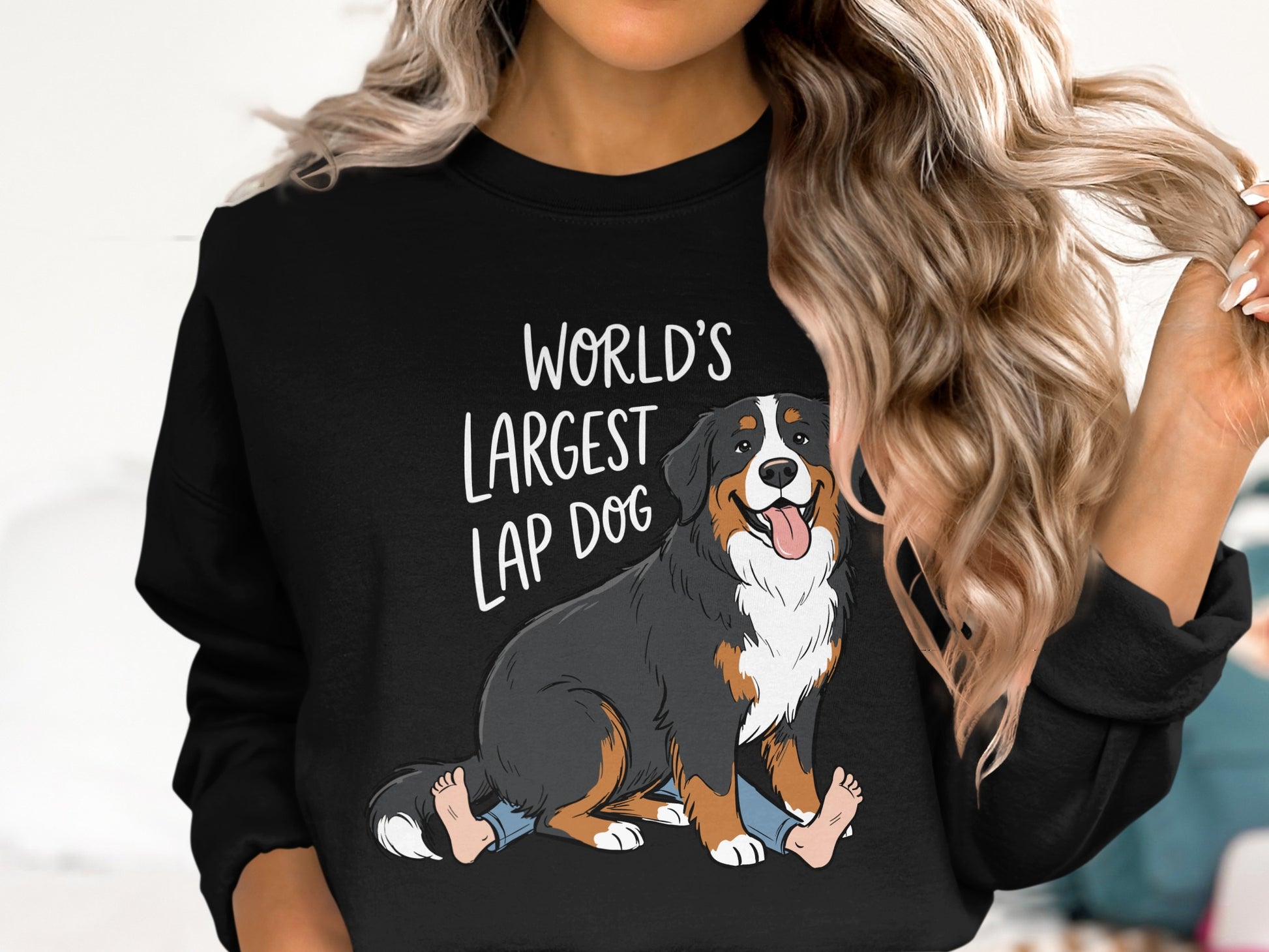 Black sweatshirt with a Bernese Mountain Dog graphic and text "World's Largest Lap Dog".
