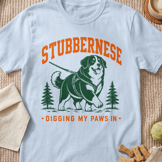 White t-shirt with an illustration of a Stubbernese dog and the text "STUBBERNESE".