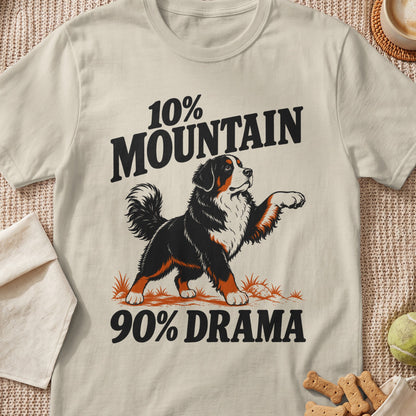 A beige t-shirt printed with a Bernese Mountain Dog graphic and the text 10% Mountain 90% Drama.