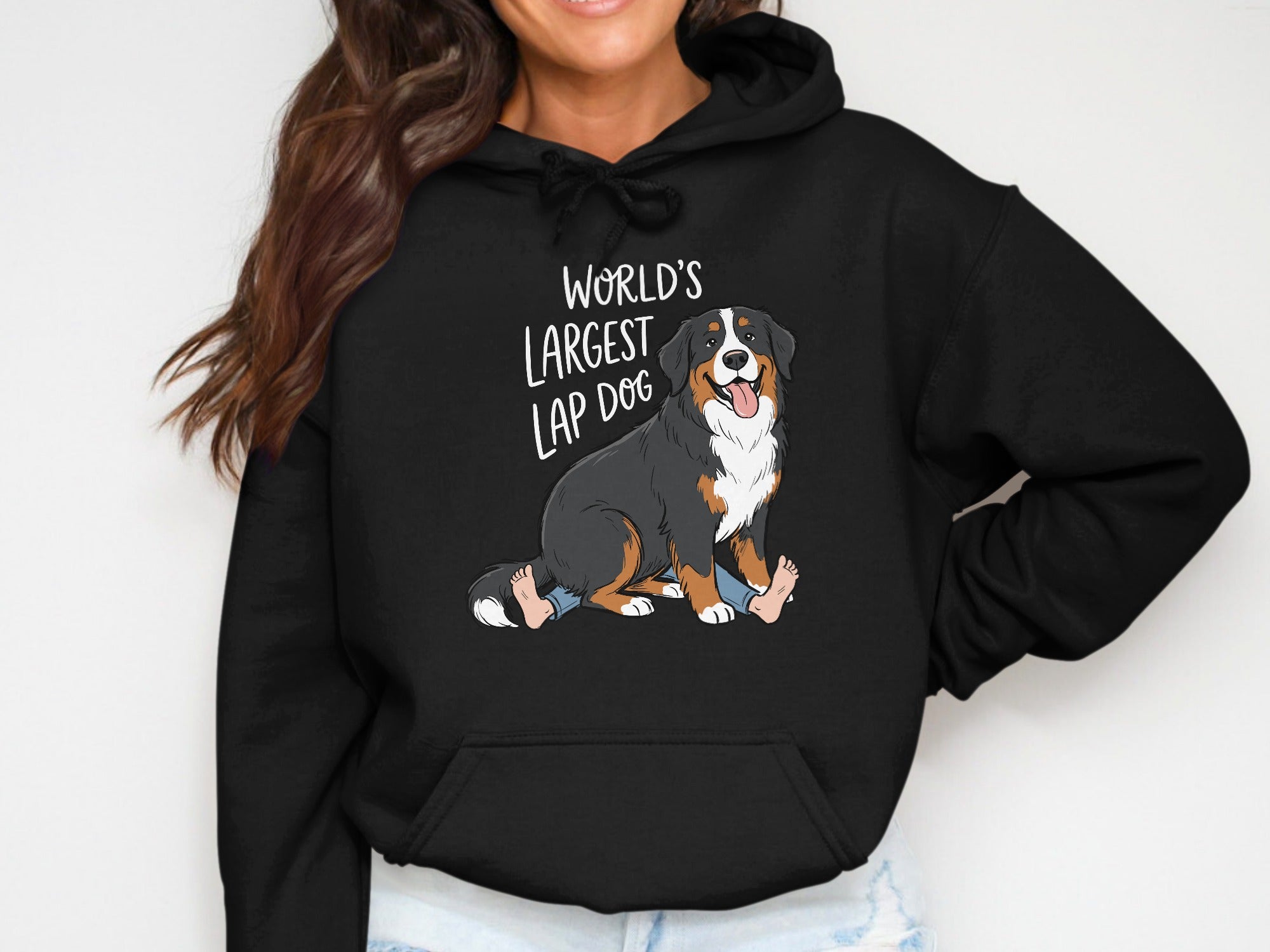 Black hoodie with cartoon Bernese Mountain Dog and text, "World's Largest Lap Dog."